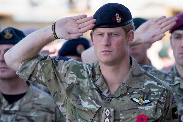 November 9, 2014: Prince Harry salutes as the Last Post is played as he joins British troops and service personal remaining in Afghanistan and also International Security Assistance Force (ISAF) personnel and civilians as they gather for a Remembrance Sunday service at Kandahar Airfield in Kandahar, Afghanistan.