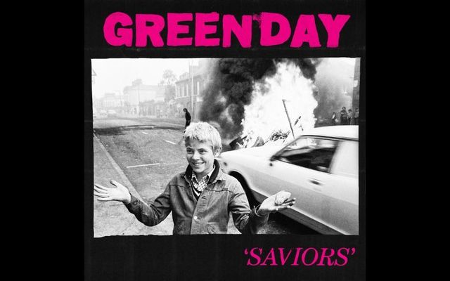 The cover for Green Day\'s upcoming album \"Saviors,\" which features an edited version of a photo taken in Belfast during The Troubles.