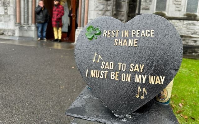 December 8, 2023:  A sign bearing lyrics from one of his songs bids farewell to Shane MacGowan outside St Mary’s of the Rosary Church in Nenagh, Co Tipperary ahead of his funeral.