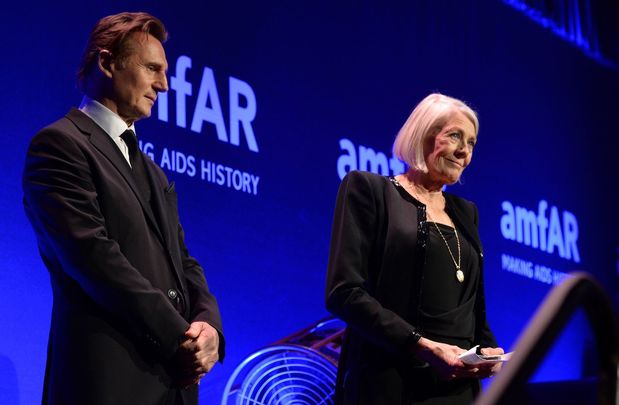 Liam Neeson and Vanessa Redgrave speak onstage during the 2014 amfAR New York Gala at Cipriani Wall Street on February 5, 2014 in New York City.