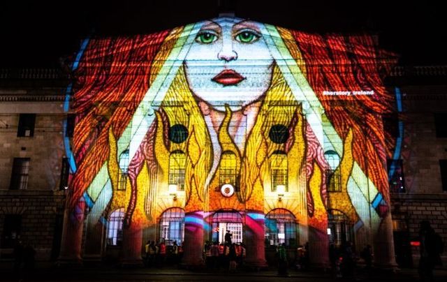 Brigid by artist Courtney Davis illuminating The GPO in Dublin for the Herstory Light Festival.