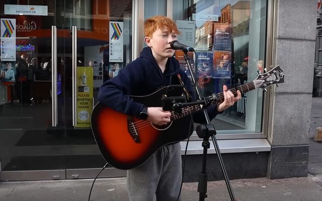 Busker Fionn Whelan, 12, performing on Dublin\'s Grafton Street.