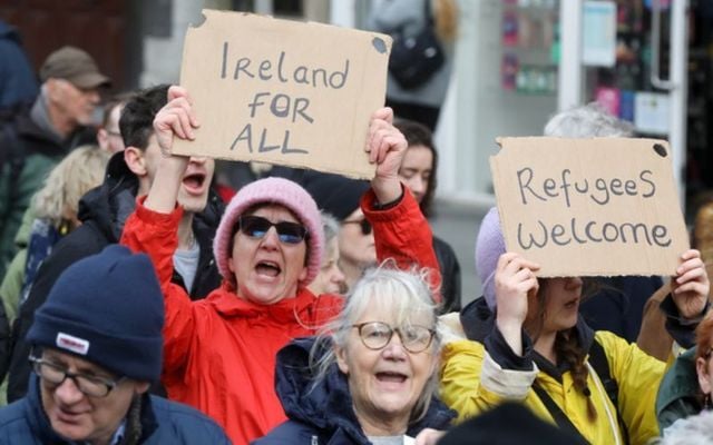 Protesters hold up placards during Saturday\'s Ireland For All March.
