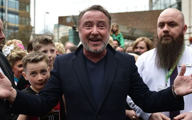 April 10, 2022: Michael Flatley, star of Riverdance and Lord of the Dance, is mobbed by fans as he makes an appearance during the opening day of the World Irish Dancing Championships at the Waterfront Hall in Belfast, Northern Ireland. 