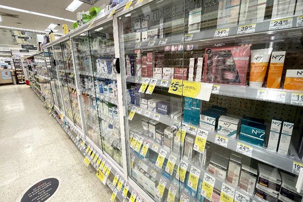Products are displayed in locked security cabinets at a Walgreens store.