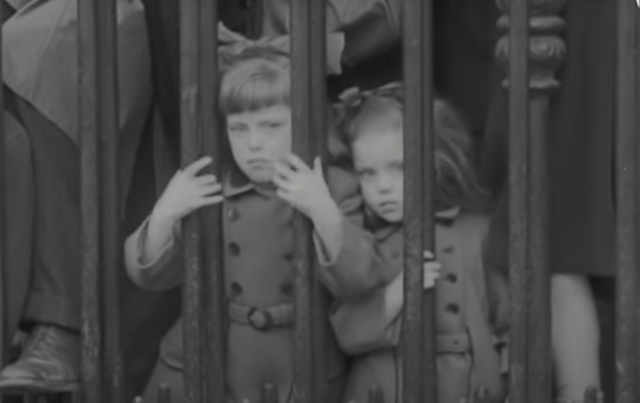 Children watching the St. Patrick\'s Day parade in 1950, in Dublin.