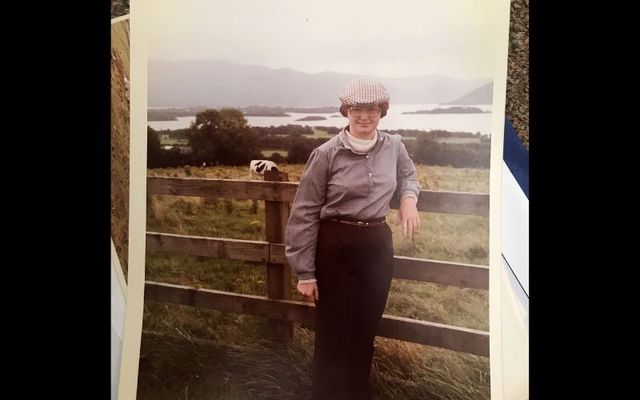 Ireland 1980 – This is Jannet L. Walsh in Killarney, Ireland, standing near Aghadoe Heights Hotel with a view of Innisfallen Island in Lough Leane, part of the Lakes of Killarney.ker