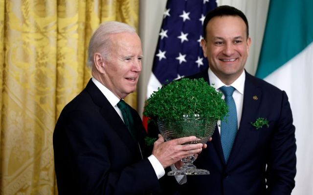 Taoiseach Leo Varadkar gifts a bouquet of Shamrocks to U.S. President Joe Biden during a St. Patrick\'s Day reception in the East Room of the White House on March 17, 2023 in Washington, DC.