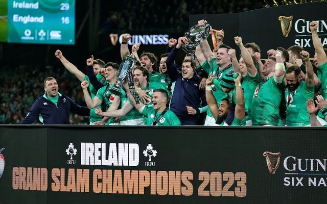 Johnny Sexton, the Ireland captain, holds the Six Nations trophy as Ireland celebrate their Grand Slam victory