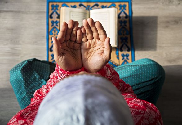 Ramadan: A Muslim man is doing Salah at home.