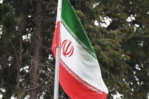 October 12, 2022: The flag of Iran flying over the entrance to the Embassy of the Islamic Republic of Iran in Dublin