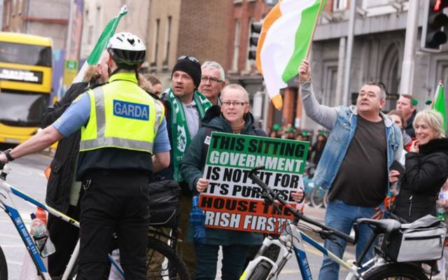 Gardaí prevent anti-immigration protests from reaching the St. Patrick\'s Day parade on O\'Connell Street. 