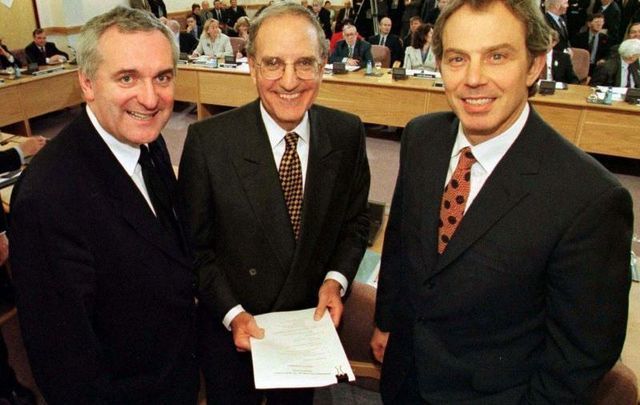 April 10, 1998: Taoiseach Bertie Ahern, Senator George Mitchell, and British Prime Minister Tony Blair at Castle Buildings Belfast, after they signed the peace agreement that will allow the people of Northern Ireland to decide their future.