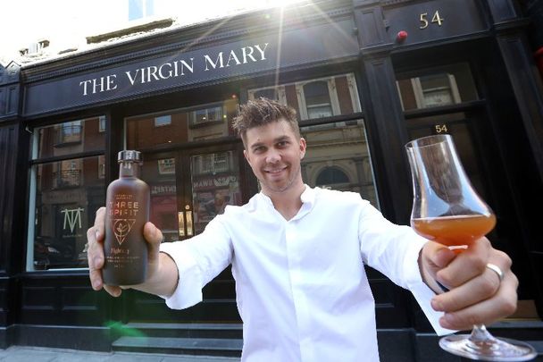 May 24, 2021: Charlie Yates outside The Virgin Mary pub in Dublin with a bottle of the Three Sprit drink.
