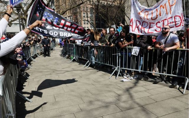 April 4, 2023: : Supporters and opponents of former President Donald Trump are kept apart outside of the Manhattan Criminal Court before his arraignment in New York City.