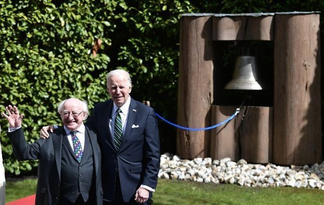 US President Joe Biden poses with Irish President Michael D. Higgins after ringing the Peace Bell at Áras an Uachtaráin. 