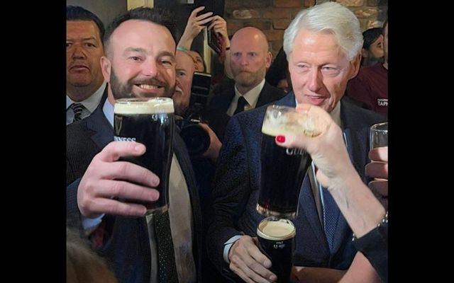 April 18, 2023: Colum Eastwood, head of the SDLP, and Bill Clinton raise a pint in Guildhall Taphouse in Derry, Northern Ireland.