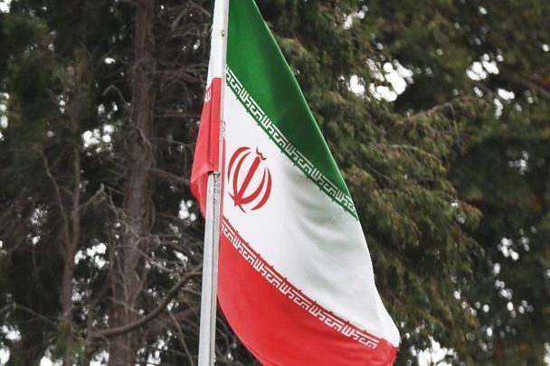 October 12, 2022: The flag of Iran flying over the entrance to the Embassy of the Islamic Republic of Iran in Dublin 