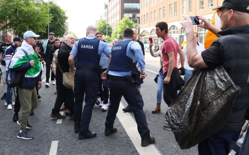 Irish leader condemns anti-immigration protests as migrant camp set on fire