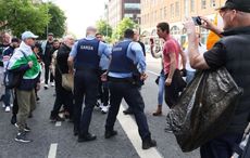 Irish leader condemns anti-immigration protests as migrant camp set on fire