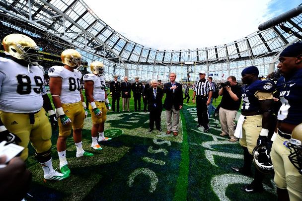 September 1, 2012: US Ambassador to Ireland, the Honorable Daniel Rooney (center left) and Taoiseach Enda Kenny take part in the opening coin toss during the NCAA Emerald Isle Classic college football season opener in Aviva Stadium.