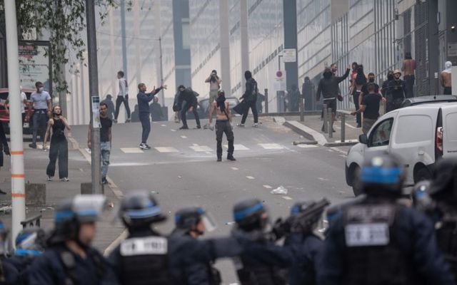 Protestors clash with French police after a memorial march for French teenager Nahel, shot by police during a traffic control stop several days ago, on June 29, 2023, in Nanterre, France.