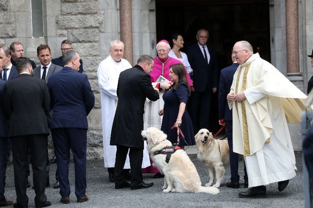 July 12, 2023: Andrew O\'Donnell\'s mother with dogs at her son\'s funeral at the Church of the Sacred Heart in Donnybrook, Dublin.
