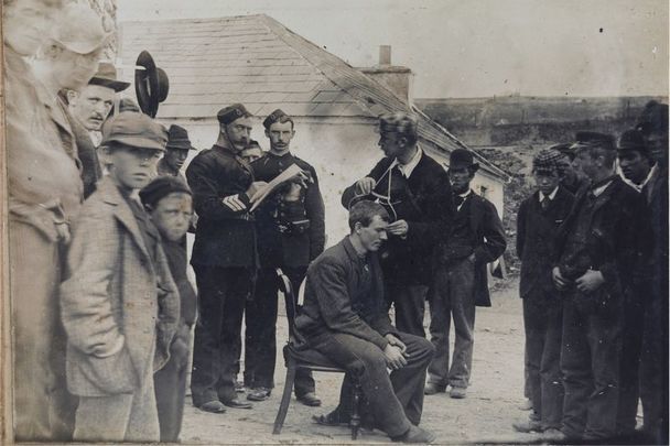 Islanders on Inishbofin being measured by a craniometer. 