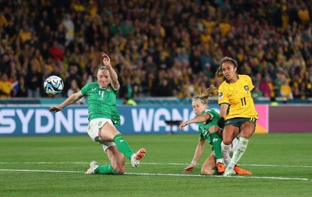 July 20, 2023: Mary Fowler of Australia shoots at goal while Louise Quinn of Republic of Ireland attend to block during the FIFA Women\'s World Cup Australia & New Zealand 2023 Group B match between Australia and Ireland at Stadium Australia in Sydney, Australia.
