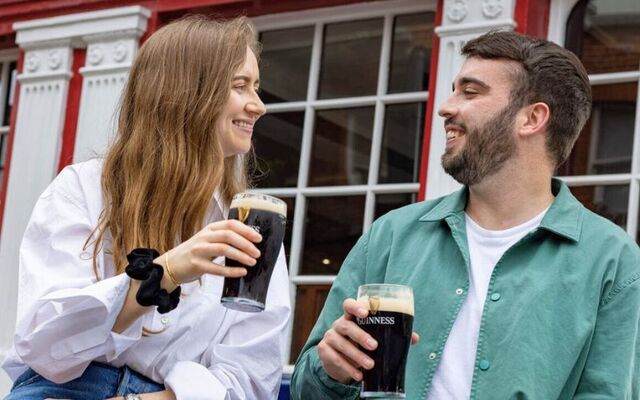 Enjoying a pint of Guinness at the Liberty Belle Pub, in The Liberties, Dublin.