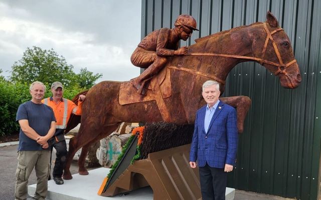 Mare of Ballinrobe. (Back left: Chainsaw Tommy, Front left Paul Mcdonell, Right: Councillor Michael Burke.)