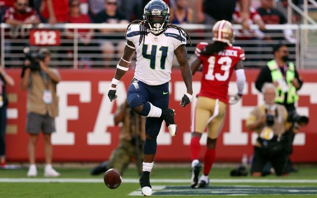 October 3, 2021: Alex Collins #41 of the Seattle Seahawks celebrates after running for a touchdown during the fourth quarter against the San Francisco 49ers at Levi\'s Stadium in Santa Clara, California.