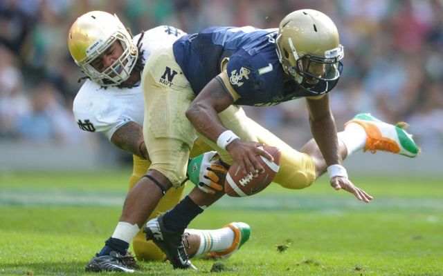 September 1, 2012: Trey Miller #1 of Navy is tackled by Ishaq Williams #11 of Notre Dame during the Notre Dame vs Navy game at Aviva Stadium in Dublin, Ireland.