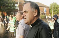 Fr. Aidan Troy back in Belfast after walking the Holy Cross gauntlet