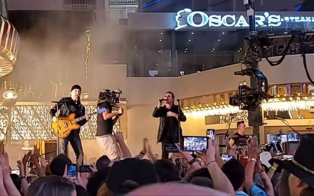 U2 performs \"Atomic City\" on Freemont Street in Las Vegas.