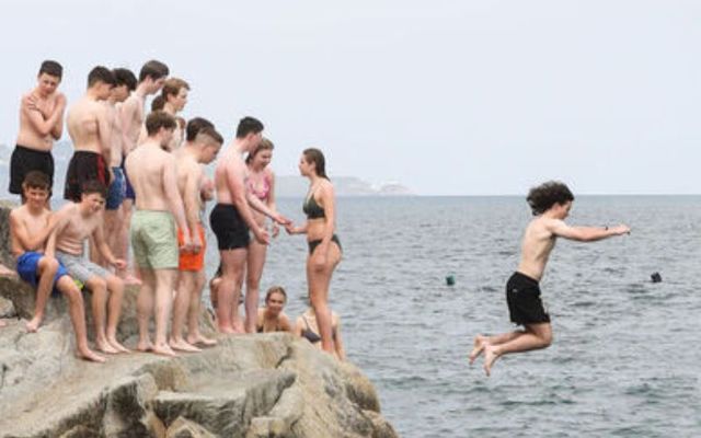 May 24, 2023: People at the 40 Foot in Sandycove, Dublin.