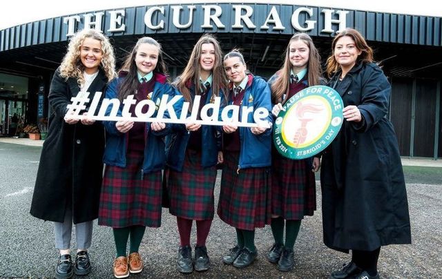 Participants of the \"Pause for Peace\" campaign at the Curragh Racecourse. 