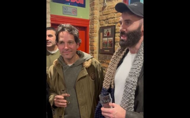 Paul Rudd listens on as Irish band Hermitage Green performs \"The Parting Glass\" in a Dublin pub.