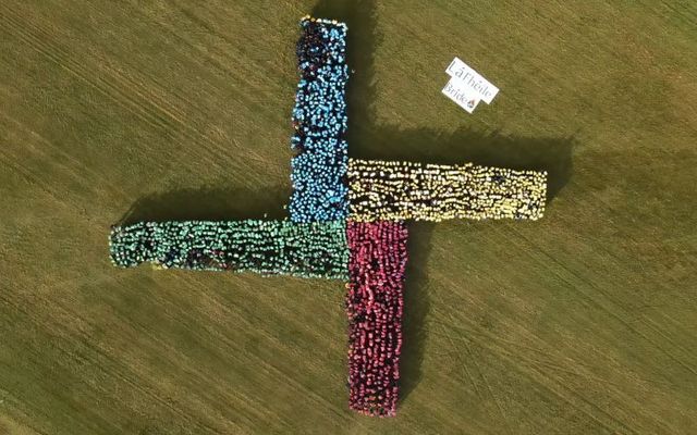 Thousands of students form a human St. Brigid’s cross on the Curragh.