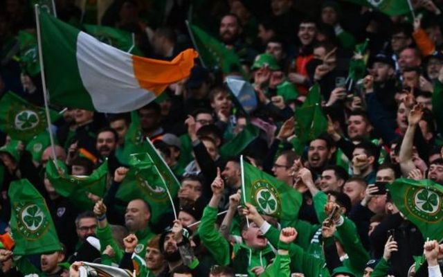 Football fans cheering on Ireland\'s Men\'s National Team.