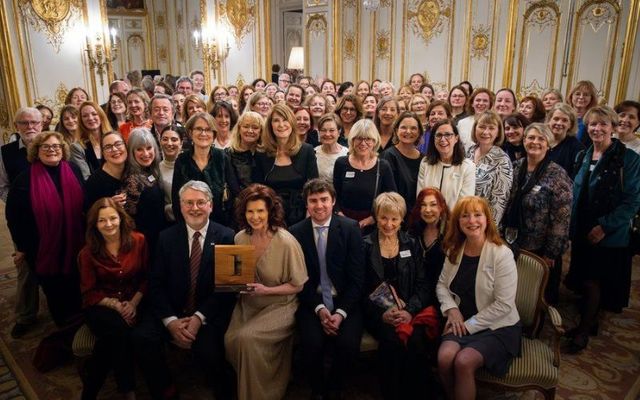 Marie Burgess, Ambassador Niall Burgess, Maria Doyle and her son Emmanuel, Mná na hEireann, and other guests.