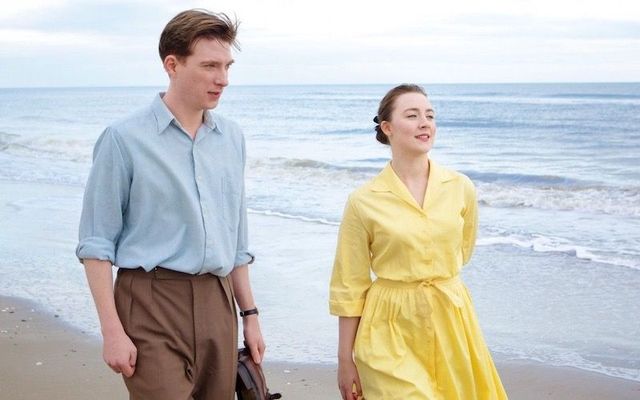 Saoirse Ronan and Domhnall Gleeson in a scene from the 2015 romantic drama \"Brooklyn.\"