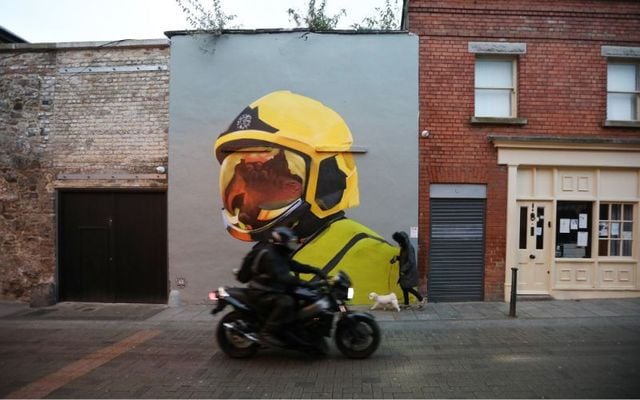 A Dublin Fire Brigade mural on Camden Street in Dublin, which is based on the award winning photo \"Response\" by Fiona Brennan.
