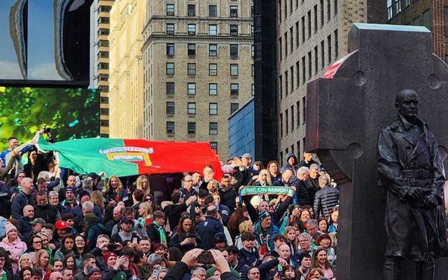 A Mayo flag is unfurled on the steps of Times Square. 
