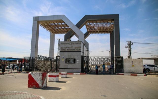 October 21, 2023: Foreign citizens look at the Rafah crossing as they wait to be allowed to travel on in Rafah, Gaza. 