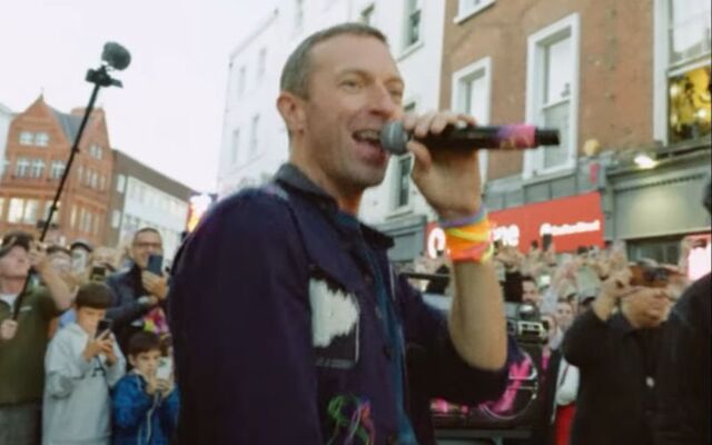 Chris Martin singing in the music video for \"We Pray\" which was filmed on Dublin\'s Grafton Street on August 28, 2024.