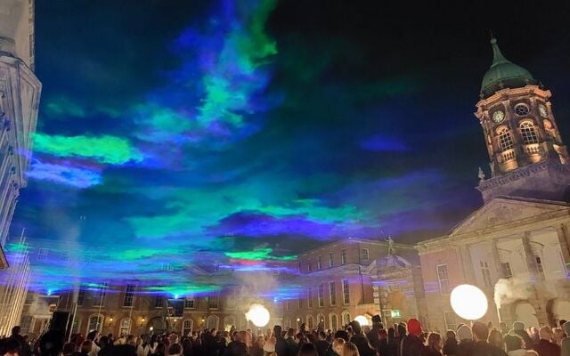 The aurora borealis appears above crowds gathered at Dublin Castle for the Bram Stoker Festival.