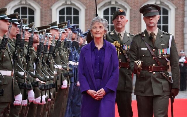 Officer in Charge of the Captain’s Guard of Honour Captain Patrick Wilson inviting the President Catherine Connolly to conduct the inspection of the Guard of Honour in the courtyard in St Patrick\'s Hall, Dublin Castle.