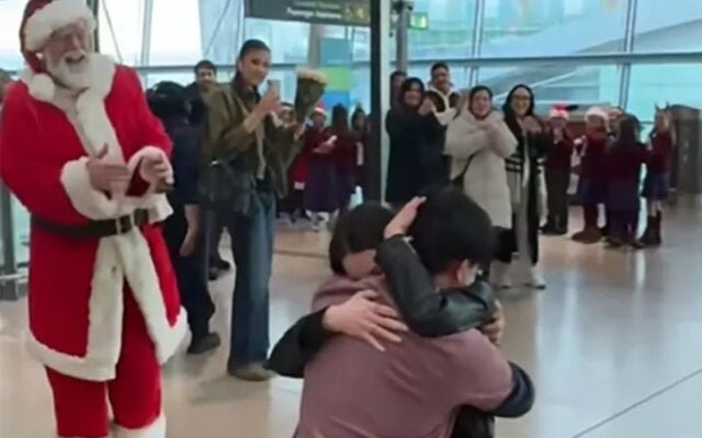 Santa joined the couple for a group hug.