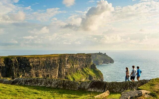 Walking the cliff top walk along the Cliffs of Moher in Co Clare.